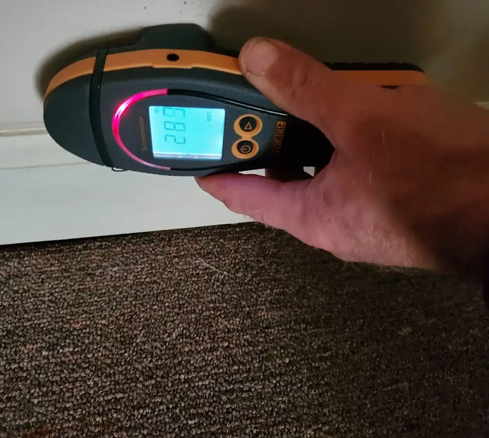 Moisture detection at baseboard during Burst Pipe Cleanup in Prairie Grove